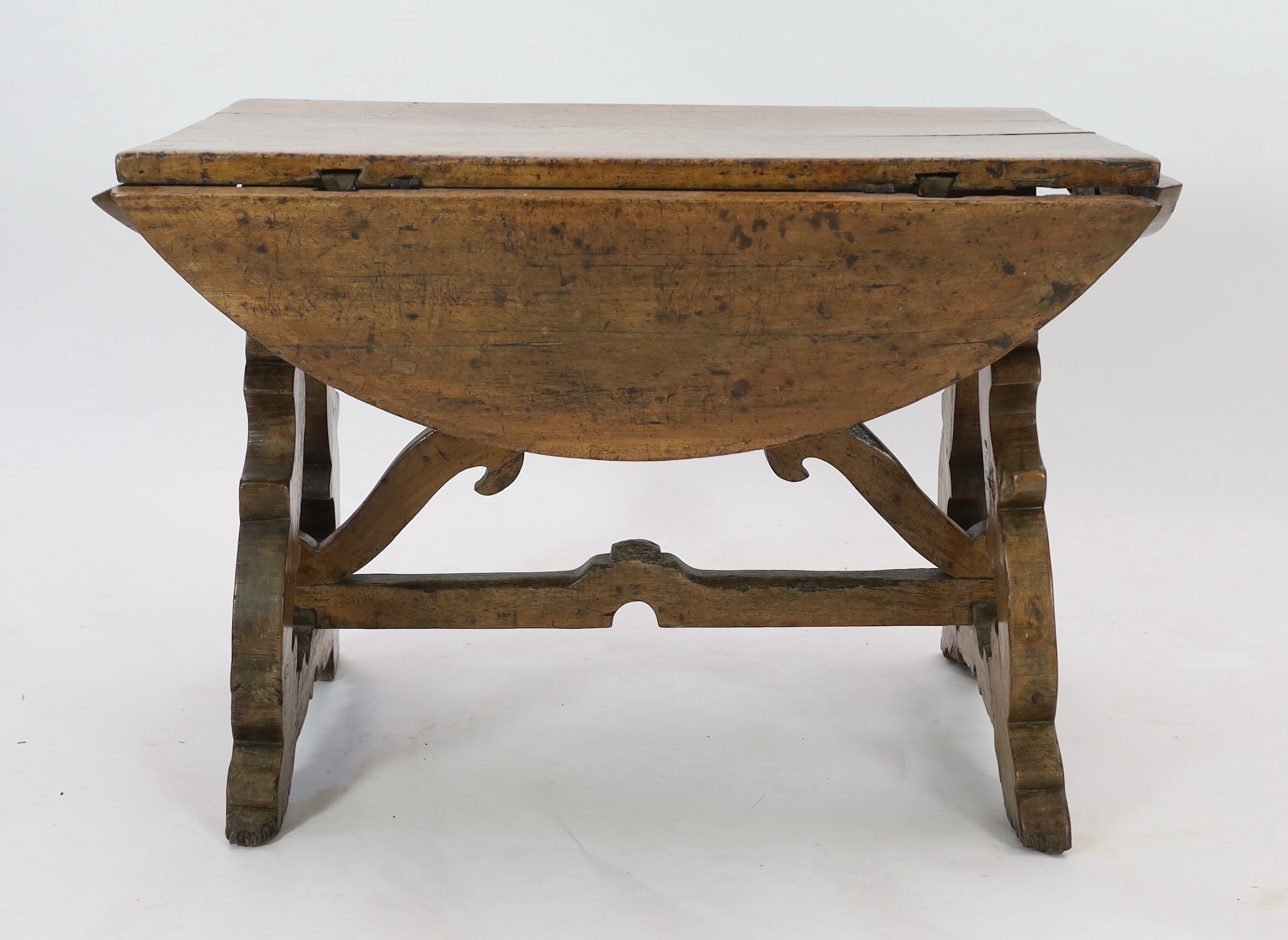 A mid 17th century Spanish walnut dining table, 115 x 74cm with flaps down, height 78cm